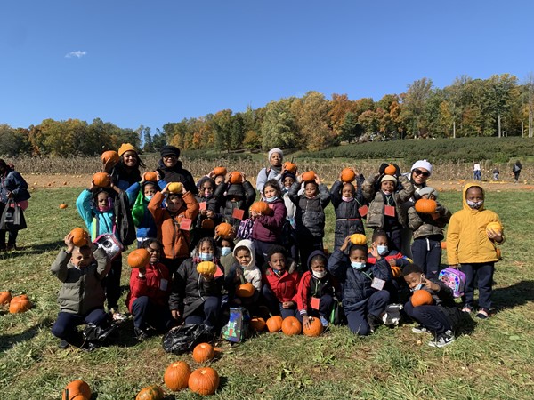Posing with pumpkins at Wightman's Farms